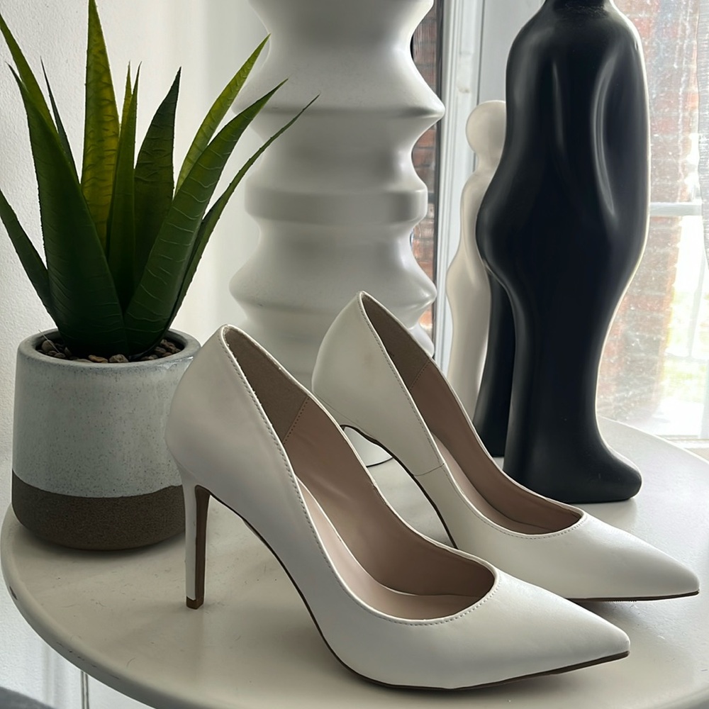 White heels by Le Chateau , size 6.5
